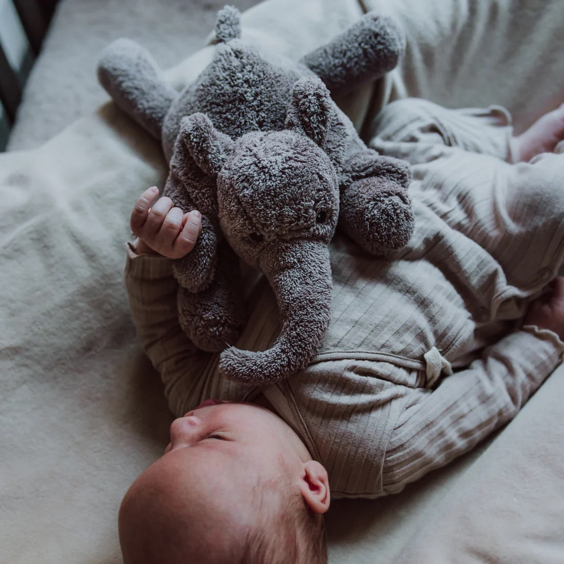 George Heartbeat Comforter (Grey) - On baby's chest