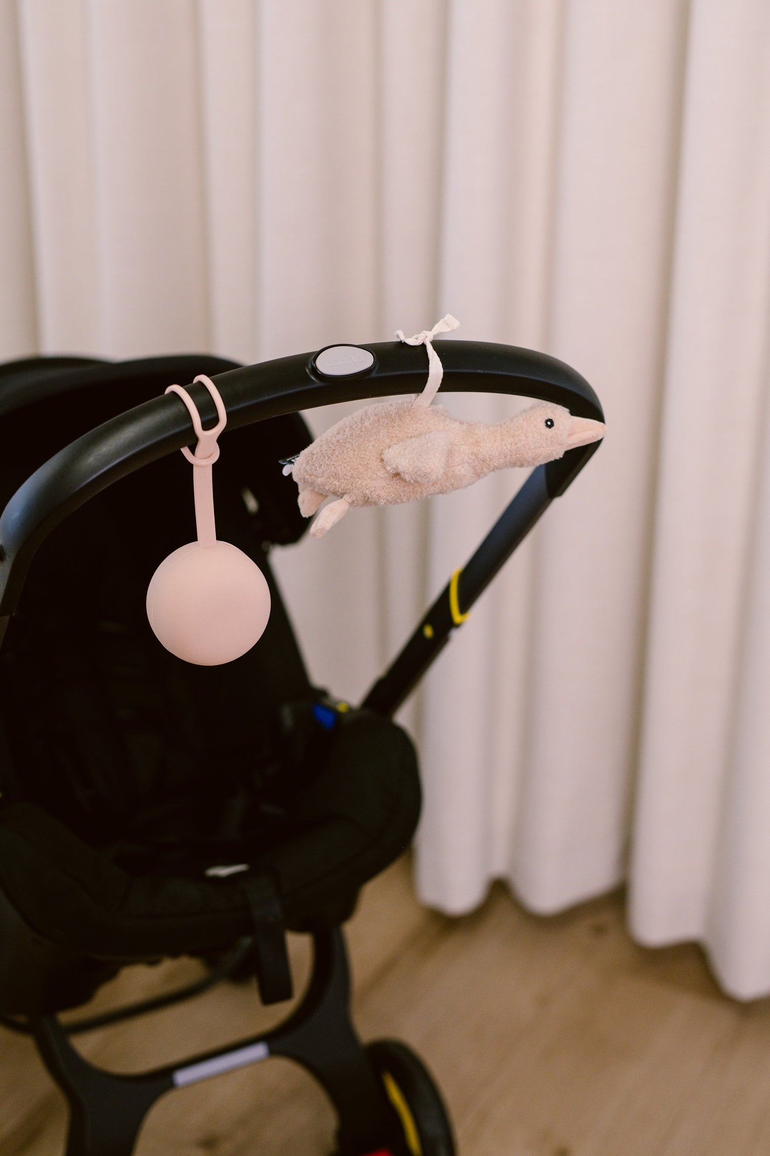 Silicone Soother Holder & Comforter on The Go on Pram - Close Up