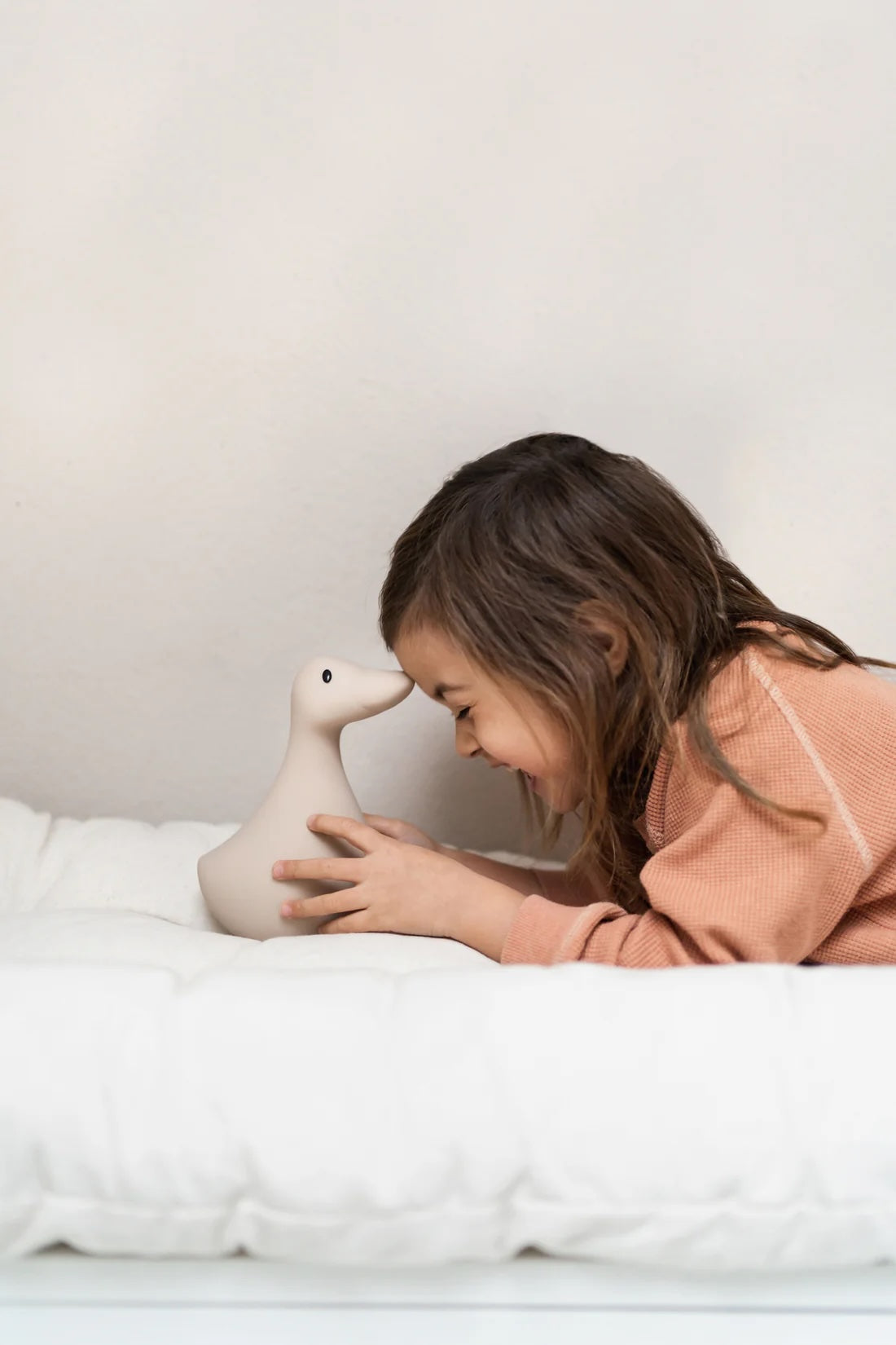 Liva Night Light - Girl Laughing on Bed - Beige